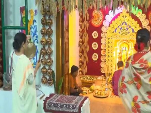 West Bengal CM Mamata Banerjee offers prayers on Kali Puja at her residence in Kolkata