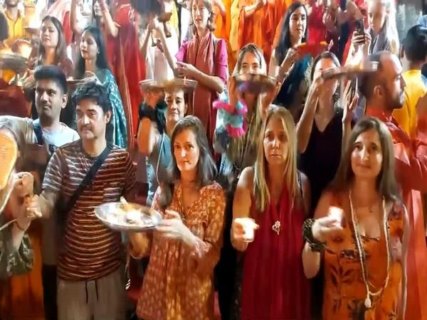 Foreign tourists perform aarti at Rishikesh's Parmarth Niketan on Diwali