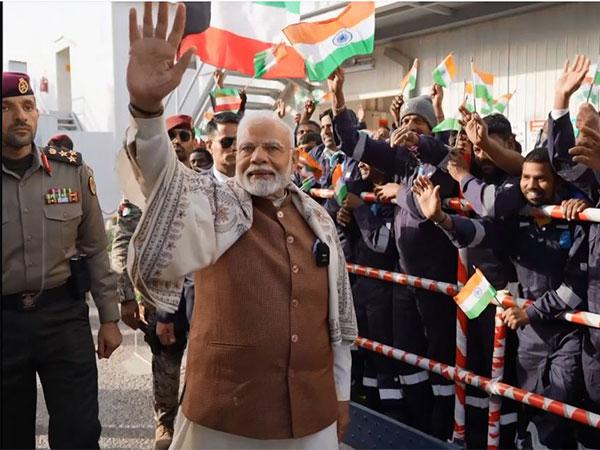 PM Modi interacts with Indian workers at Gulf Spic Labour Camp in Kuwait